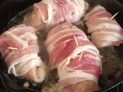 Chicken Wrapped In Bacon With Garlic Cooking